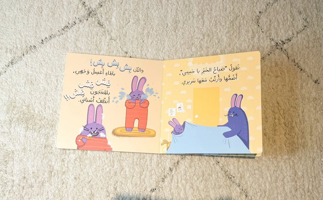 Open book with cartoon bunnies on a textured surface